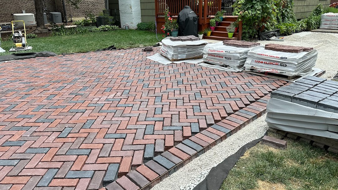 TRANSFORMING DRIVEWAYS WITH ELEGANCE: A DETAILED LOOK AT OUR LATEST HERRINGBONE PATTERN DRIVEWAY PROJECT IN NAPERVILLE, ILLINOIS Thumbnail