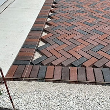 TRANSFORMING-DRIVEWAYS-WITH-ELEGANCE-A-DETAILED-LOOK-AT-OUR-LATEST-HERRINGBONE-PATTERN-DRIVEWAY-PROJECT-IN-NAPERVILLE-ILLINOIS 1