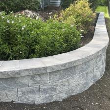 Transforming-Landscapes-The-Artistry-of-Mission-Brick-Pavings-Curved-Retaining-Wall-in-Naperville-Illinois 1