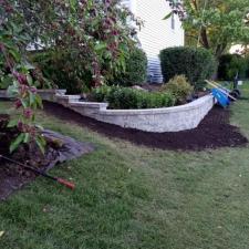Transforming-Landscapes-The-Artistry-of-Mission-Brick-Pavings-Curved-Retaining-Wall-in-Naperville-Illinois 3